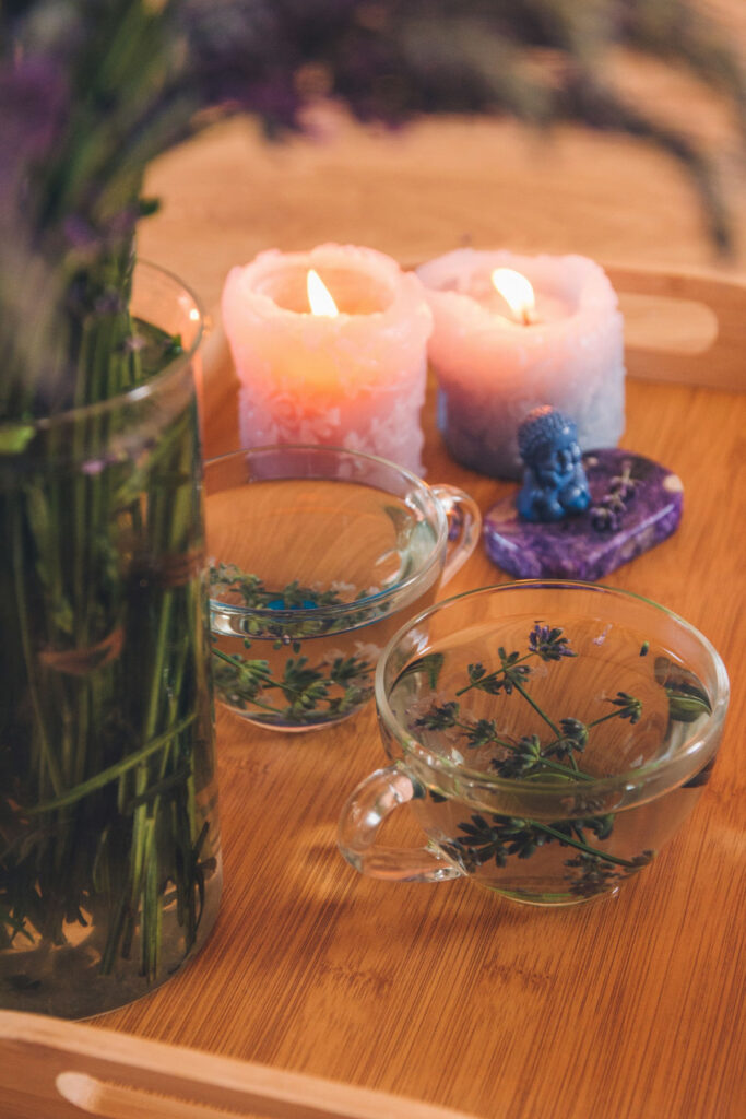 Aromatherapy herbs in oil with candles for a relaxing massage experience