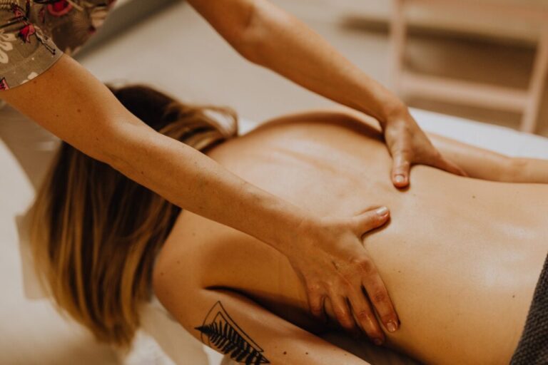 Massage therapist working on back during massage therapy treatment